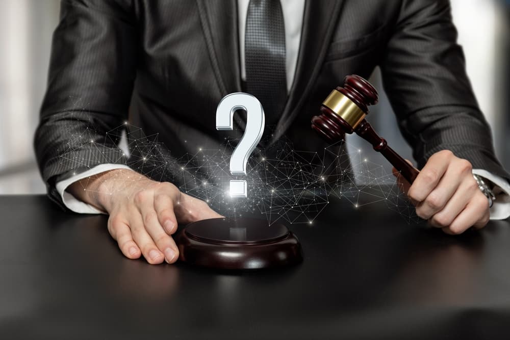 A personal injury lawyer with question mark sign