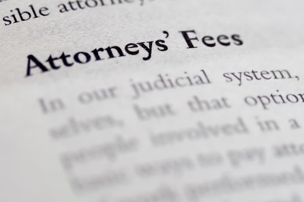 Law book with attorneys fees focused in closeup of explanation