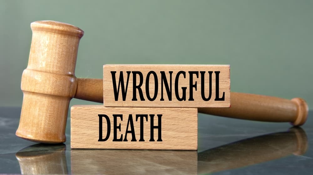 Wrongful Death on wooden cubes with gavel